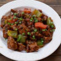 Chicken Manchurian (Wet) · Chicken sautéed with onions, bell peppers & soy sauce.