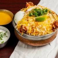 Hyderabad Chicken Dum Biryani · Fragrant basmati rice layered and slow cooked with 1/4 chicken leg, blended with herbs and s...