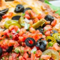 Nachos Locos · Nachos smothered with melted cheddar jack cheese, sliced jalapeños, sour cream, black olives...