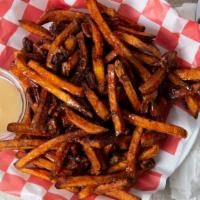 Sweet Jesus Fries · Sweet potato fries drizzled with house made cinnamon sauce, topped with glazed pecans.