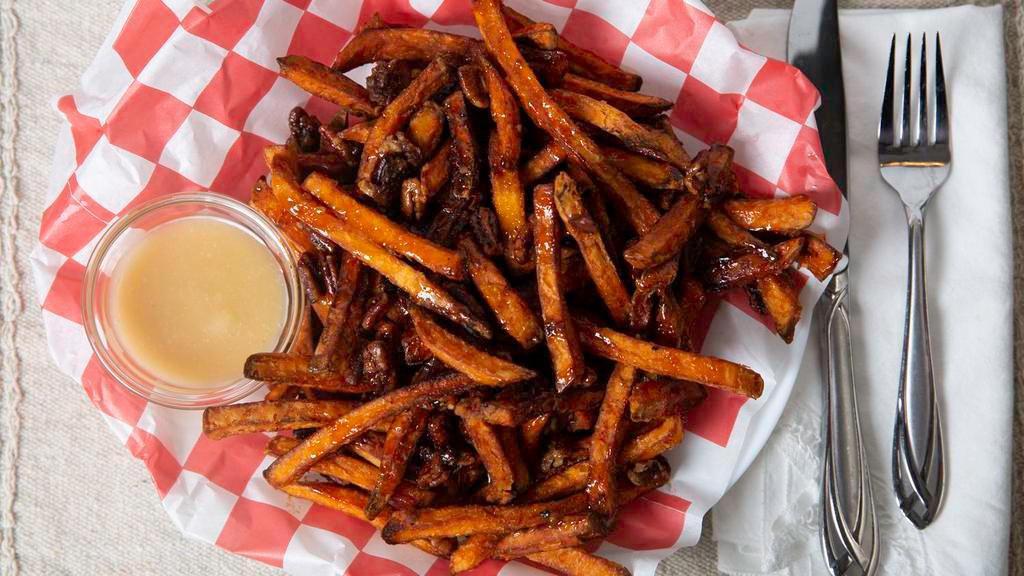 Sweet Jesus Fries · Sweet potatoes fries drizzled with housemade cinnamon sauce topped with glazed pecans.
