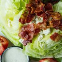 The Wedge · Gluten-free. Crispy iceberg wedge with crumbled blue cheese, tomatoes, and crumbled bacon.