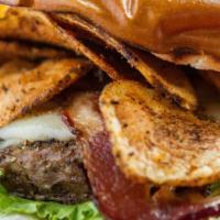 The Burgundy · 8oz. burger, bacon, and swiss cheese, cajun dipped and topped with chips.

Menu items can be...