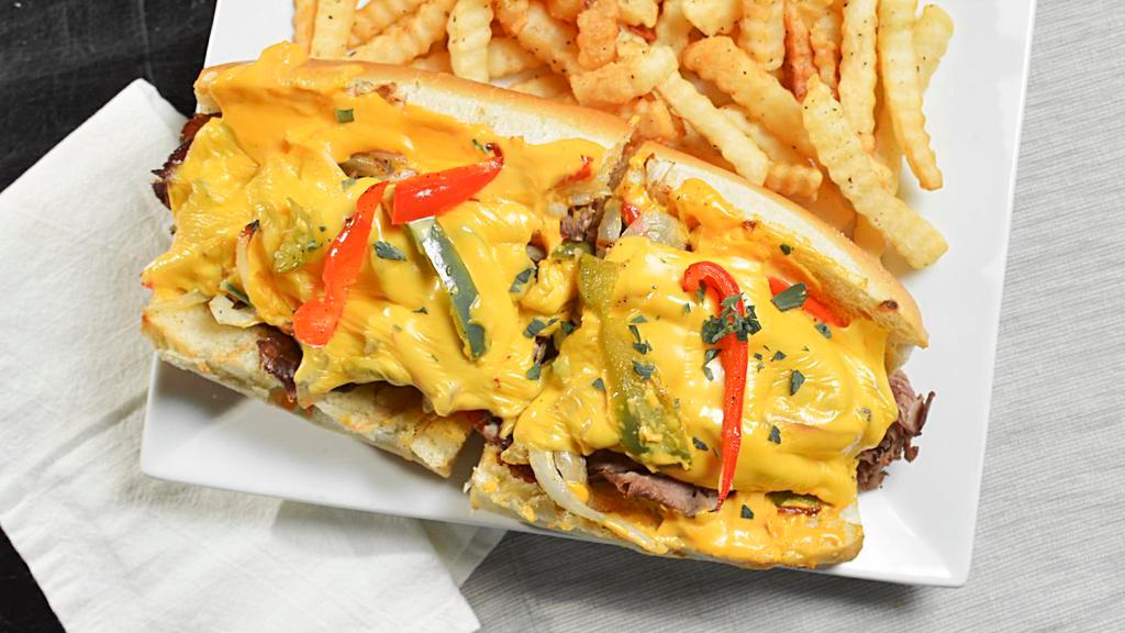 Philly Cheese Steak · Sliced roast beef, sautéed onions, and peppers, melted American and nacho cheeses on a hero.