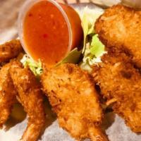 Coconut Shrimp · Six per order. Crispy fried and served with a Thai chili pineapple sauce.