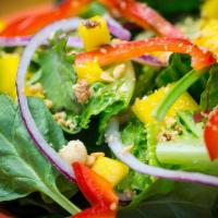 Mixed Green Salad · Mixed greens with red bell peppers, red onions, mac nuts, mango and your choice of dressing