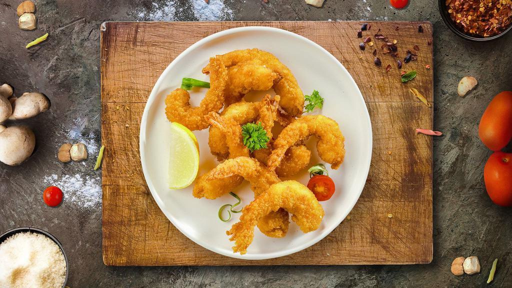 Golden Shrimps · Fresh shrimp battered and fried until golden brown. Served with cocktail sauce or your choice of sauce.