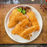 Chicken Cluck Fingers · Bite sized nuggets of chicken breaded and fried until golden brown. Served with your choice ...