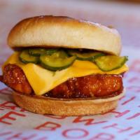 Bbq Chicken Sandwich · Fried Chicken Tenders tossed in BBQ Sauce topped with American Cheese and Bread & Butter Pic...