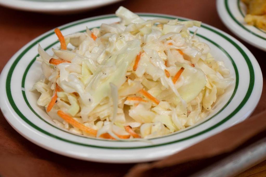 Coleslaw · Shredded Cabbage and Carrots in our Sweet & Tangy Slaw Dressing.