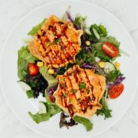Spicy Ahi Wonton Salad · Fresh green salad served with two pieces of our homemade spicy ahi wonton.
