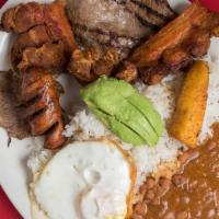 Bandeja Campesina · Peasant platter. Top round steak, fried eggs, salt pork skin, and avocado.