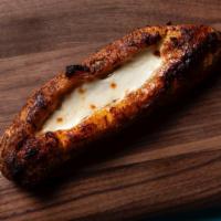 Sweet Plantain & Queso · Whole Sweet Plantain roasted in the oven with Guayanes Cheese (Venezuela young Cheese)
