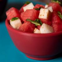 Watermelon & Jicama Salad · Watermelon & Jicama Salad with mint Leaves Lime and Chile Piquin (Mild & Tangy)