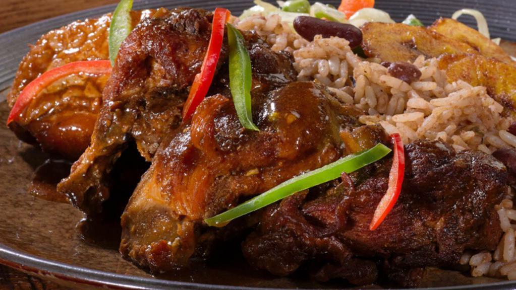 Brown Stew Chicken · Served with rice and peas or white rice and steamed vegetable or collard greens.