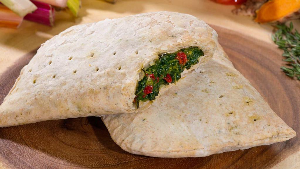 Spinach Patty · Seasoned steamed spinach wrapped in a spinach-speckled whole wheat flaky crust.