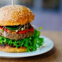 Vegetarian Burger · Fresh off the grill Veggie Burger topped with lettuce, tomato, and onion.