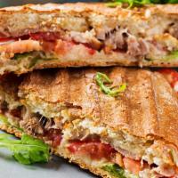 Russian Panini · Grilled Panini Sandwich made with Roasted beef, muenster cheese, caramelized onions, lettuce...