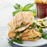Chicken Club Panini · Grilled Panini Sandwich made with Grilled chicken, smoked bacon, brie cheese, plum, tomatoes...