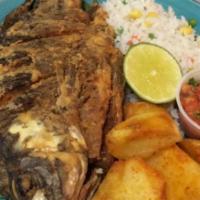 Whole Fish · Served with white rice, baked potato or plantains and a small salad.
