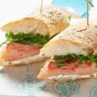 Smoked Salmon Sandwich · Smoked Atlantic salmon, cream cheese, red onions, tomatoes, capers, and arugula.
