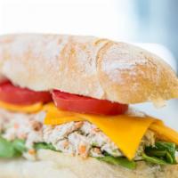 Tuna Melt Sandwich · Tuna fish, celery, red onions, carrots, Cheddar cheese, tomatoes, and lettuce.