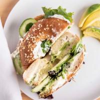The Ultimate Veggie Bagel · Toasted Bagel, cream cheese, cucumber, avocado,  tomato, spinach.