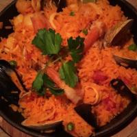 Paella · saffron rice, mussels, shrimp, clams, peas, tomatoes, scallops & calamari