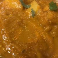 Chicken Vindaloo · Chicken and potatoes in hot and sour curry sauce.