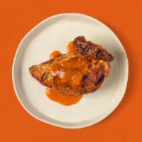 Quarter White Meat Chicken · Rotisserie chicken breast and wing covered with delicious, spicy Jerk sauce.
