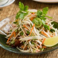 Som Tum · Traditional Green Papaya Salad with Long Beans, Dried Shrimp & Peanuts. Available Vegan.