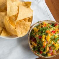 Yucateco Guacamole · Hass avocado, mango, habanero chile, red onion, bell pepper, cilantro. Served with chips
