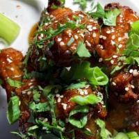 Honey Wings · Jumbo chicken wings tossed in cascabel chile sauce, cilantro, toasted sesame seeds. Creamy j...