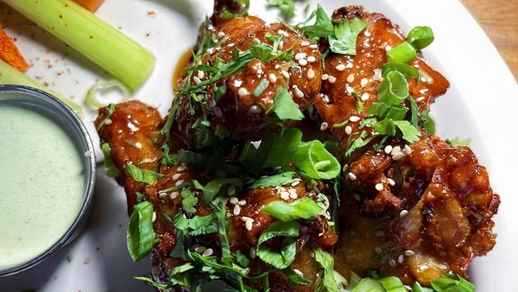 Honey Wings · Jumbo chicken wings tossed in cascabel chile sauce, cilantro, toasted sesame seeds. Creamy jalapeño dipping sauce on the side with jicama and vegetables.
