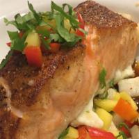 Salmon Yucateco · Pan seared filet of salmon, mango, habanero chile, red onion, bell pepper, cilantro.