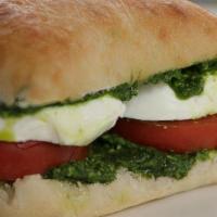 Caprese Sandwich  · Ciabatta with fresh mozzarella and tomatoes, black pepper, and sea salt