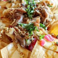 Carnitas Nachos · Homemade Mexican style 8 hours slow-cooked pork shoulder.
