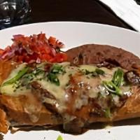 Carne Chimichanga · Grilled marinated New York strip steak. Served on a fried 12
