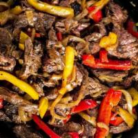 Carne Asada Fajita · Grilled marinated New York strip steak. Served with your choice of 3 soft shell corn tortill...