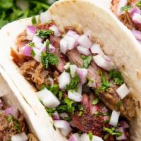 Chorizo Taco · Mild spicy homemade Mexican pork sausage. Choice of Mexican-style, topped with cilantro and ...