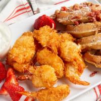 Chicken And Bacon Waffle · one waffle cook with bacon on the inside, served with strawberries top with powdered sugar a...