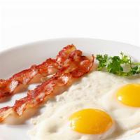 Kori'S Breakfast Slam · 3 pancake, 2 bacon or sausage,  eggs and fresh strawberries.