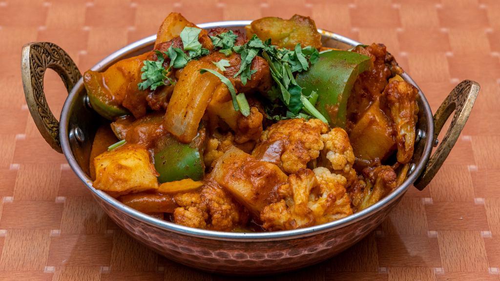 Aloo Gobi · Vegan, gluten free. Potato, cauliflower, onion, pepper and tomato stir-fried with homemade masala powder.