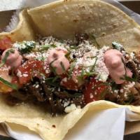 Short Rib Barbacoa · Pico de gallo, cilantro, cotija cheese, and pinks crema.