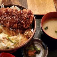 Sauce Katsu Don · Pork cutlet, cabbage, egg and tonkatsu sauce over rice.