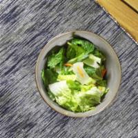 Garden Salad With Avocado · Medium garden salad with sliced avocado on top.
