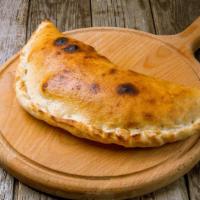 Spinach Calzone · Green, fresh spinach stuffed into a warm calzone.