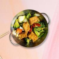 Golden Tofu & Veggies · Mixed veggies with fried tofu.