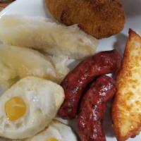 Strikes (3) / Golpes (3) · Mangu( mashed plantain) with 2 eggs, fried salami, fried cheese