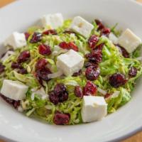 Brussels Sprout Salad · Shredded fresh Brussels sprouts, dried cranberries, feta cheese, shallots, house-made red wi...
